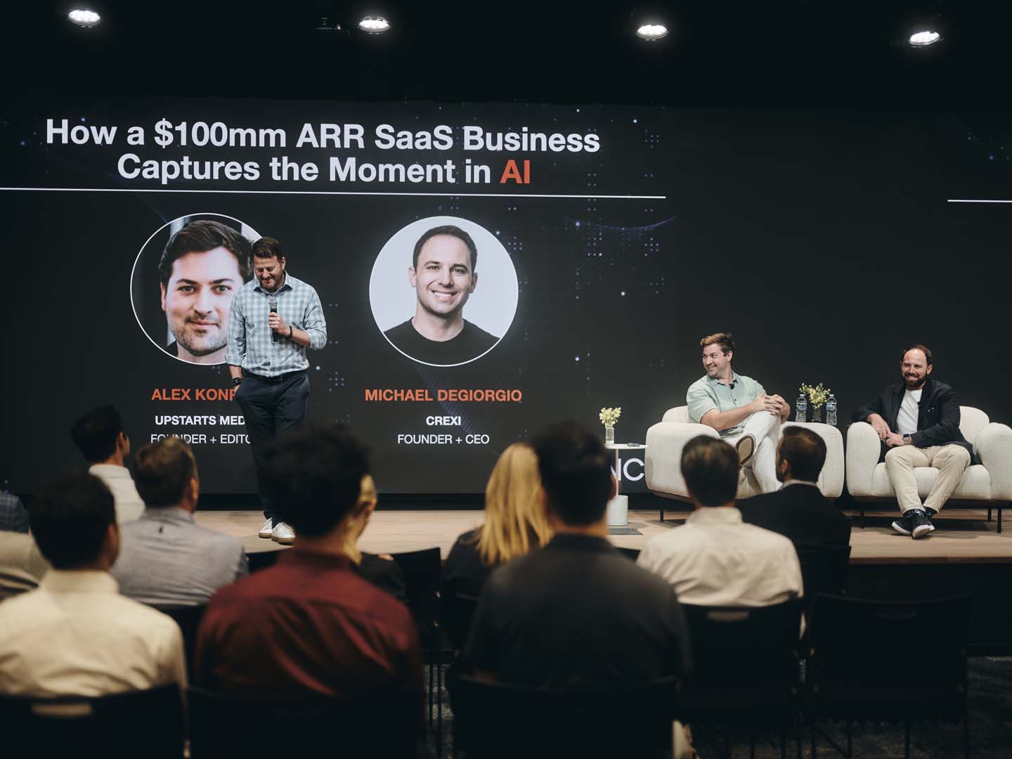 Guest session under a branded screen at the Summit