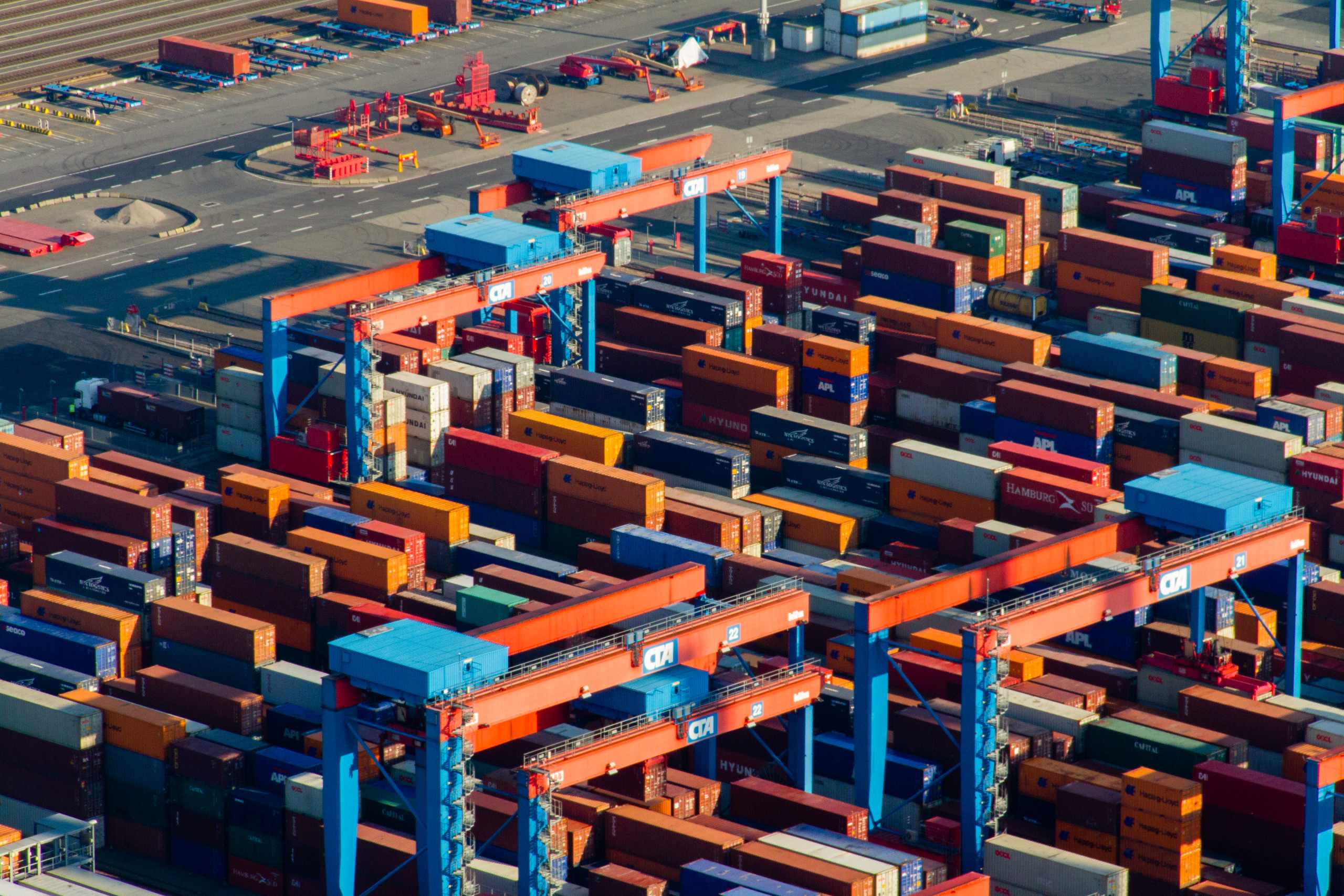 Dense container-stack aerial in red and blue